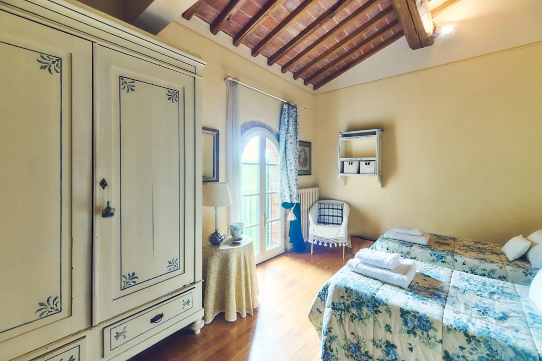 Blue guest bedroom at Villa Niccolai