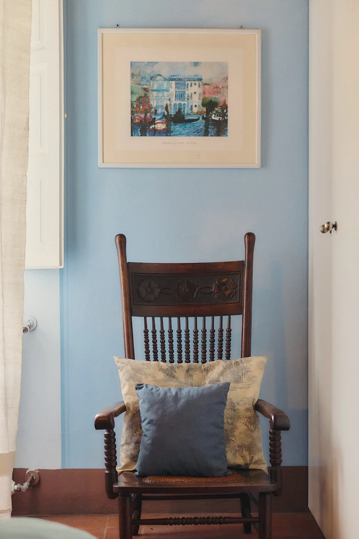 Antique chair and artwork inside Villa Niccolai