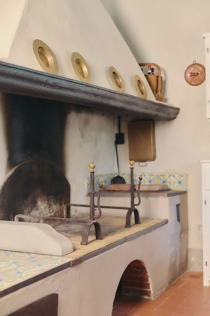 Historic Tuscan kitchen fireplace at Villa Niccolai